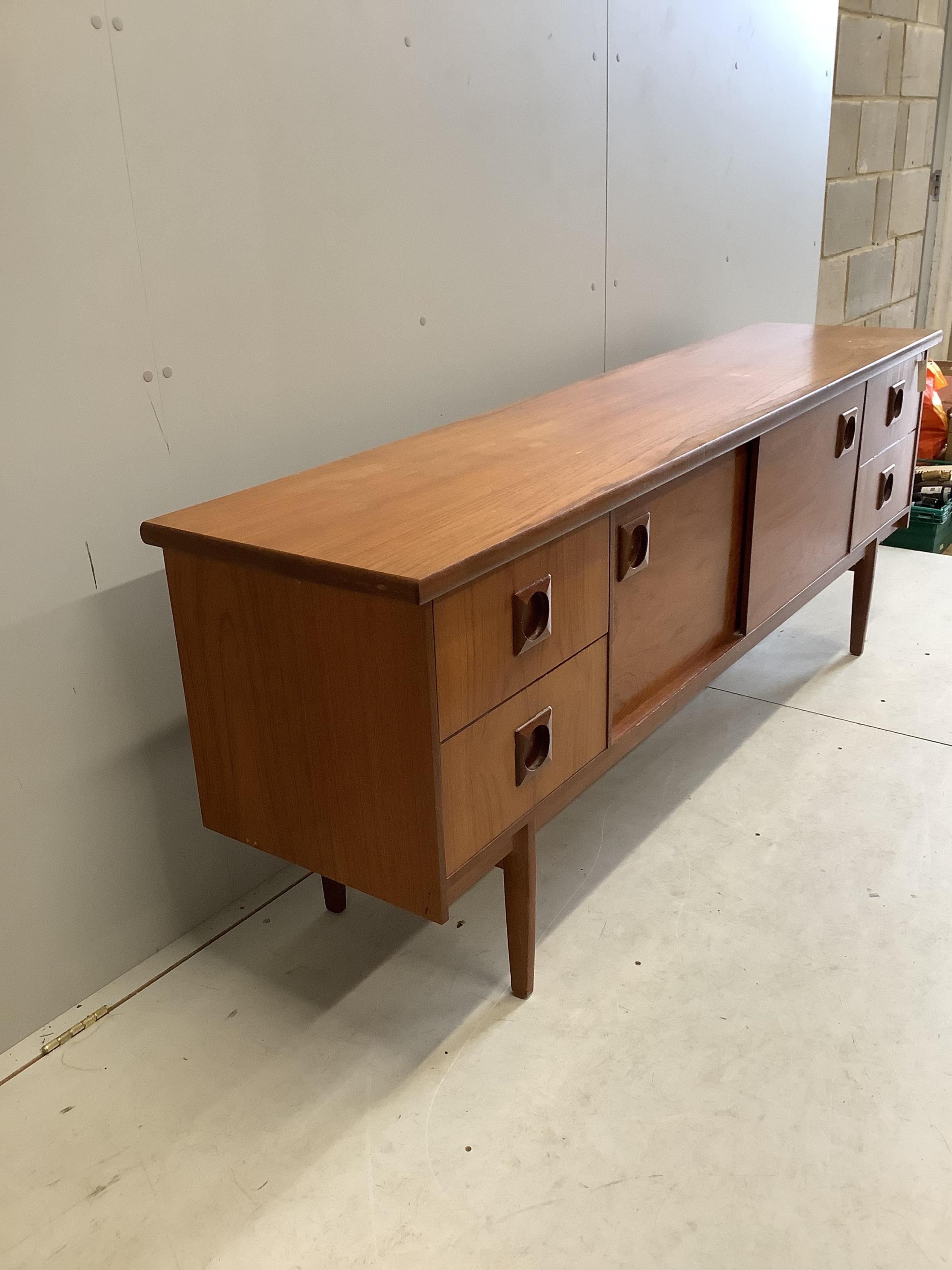 A mid century Bath Cabinet Makers teak sideboard, width 198cm, depth 45cm, height 73cm. Condition - fair